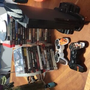 PS3 console with Charger port 2 controllers and 35 games